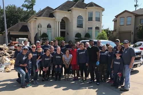 Group photo of Dr. Adam Wright and some of the DBU faculty, staff and students who went to serve in Houston.
