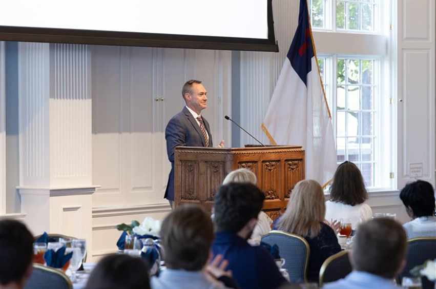 Dr. Blake Flickner shares with staff about his time at DBU and the recent college basketball season