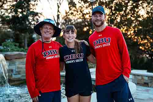 Sam Jones standing with DBU Soccer Coaches