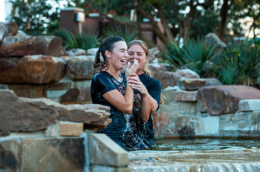 DBU soccer player getting baptized