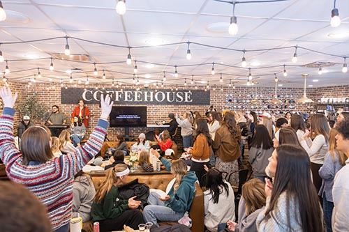 DBU students worshipping Jesus together in the coffeehouse on campus during a snow day