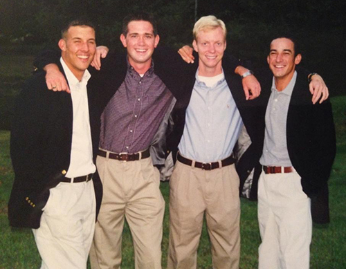 Rob Hahn standing with a group of his college friends