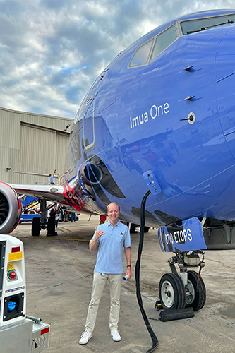 Rob Hahn standing outside next to a Southwest Airlines airplane