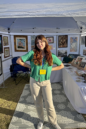Ashley Huff selling her artwork at a local event