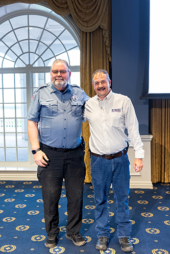Don Kabetzke standing with coworker for photo
