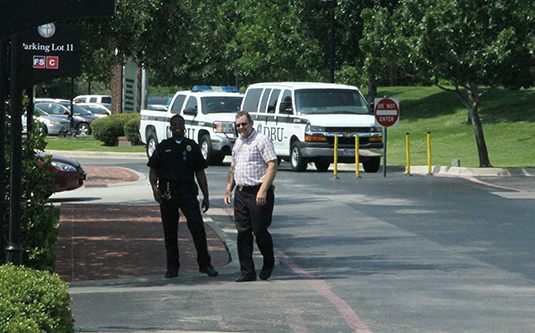 old photo of Don Kabetzke outside standing with a coworker