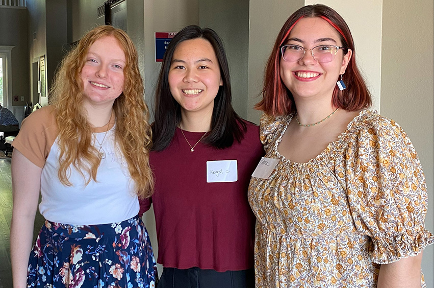 two college students standing together for a group photo for DOXA