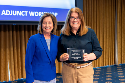 Muriel Wilson with Adjunct of the Year award beside Dr Hedin