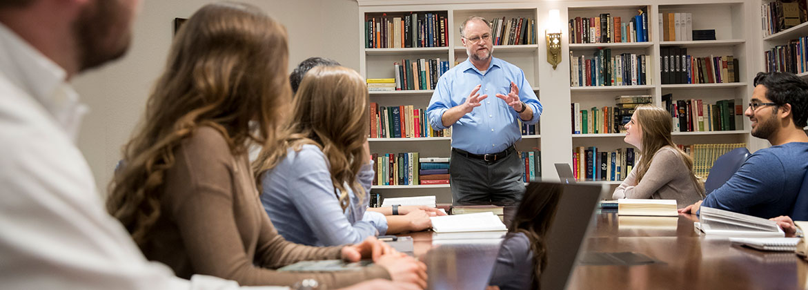 DBU faculty member, Dr. Mike Williams, teaching undergraduate students in the Nation conference room - Dallas, Texas