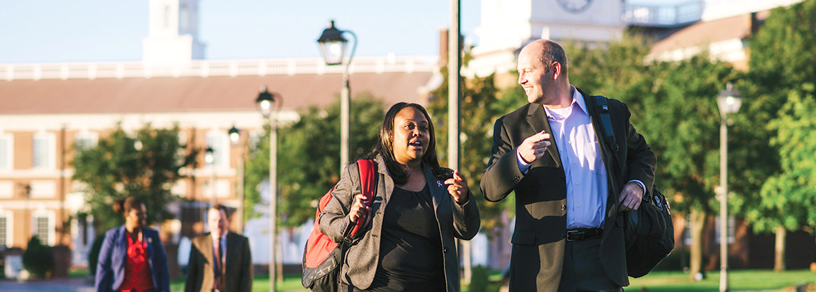 two people walking and talking