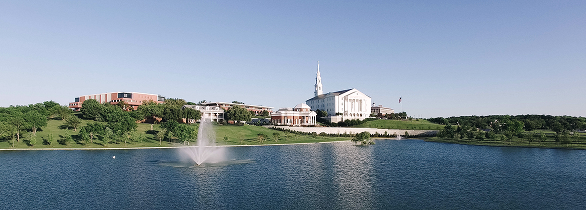 a drone shot of campus in front of the pond