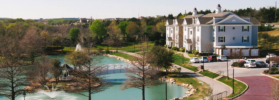 dallas on campus apartments - outside by bush pond