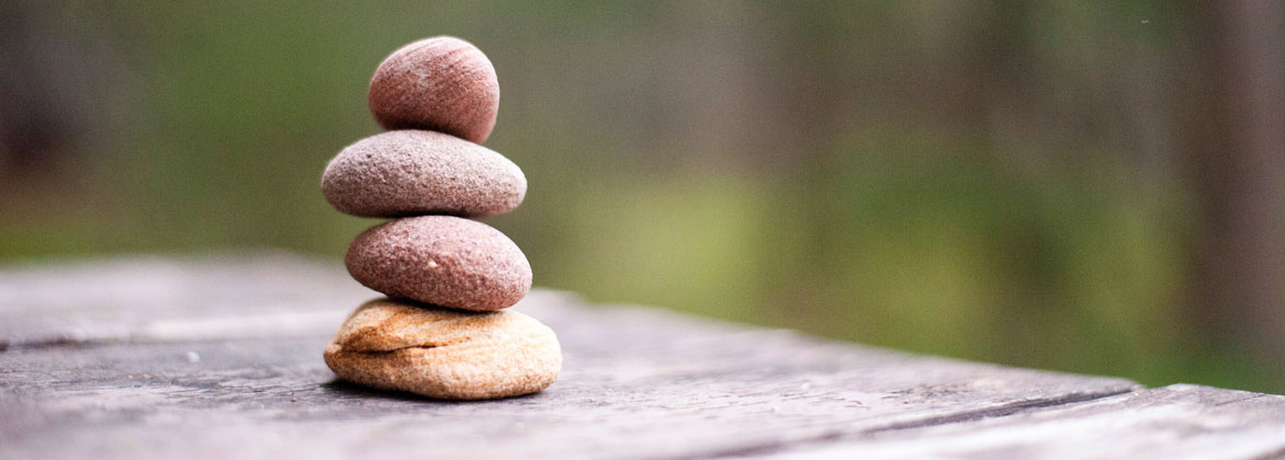 4 rocks piled on top of each other outside