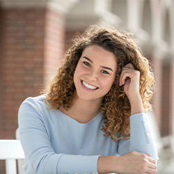 picture of a woman with a blue shirt smiling