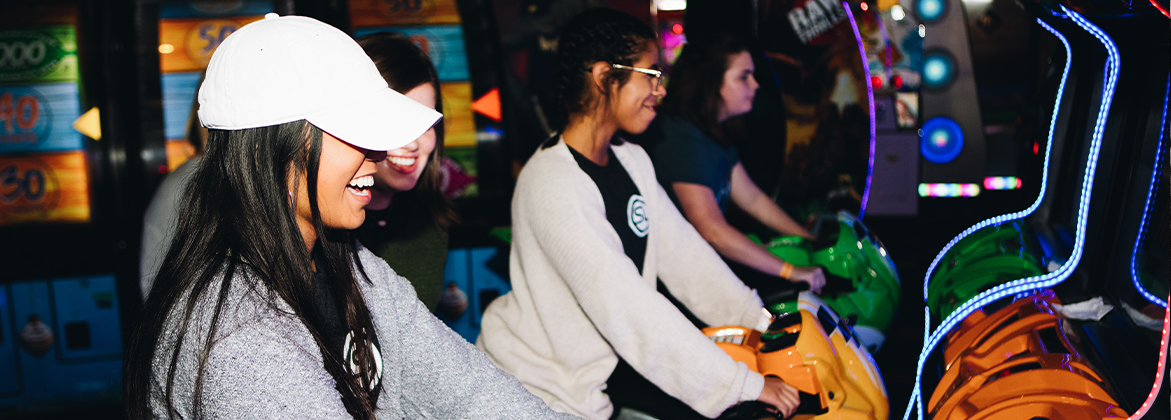 Students playing arcade games