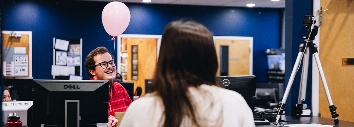 Student being serenaded for Valentine's Day