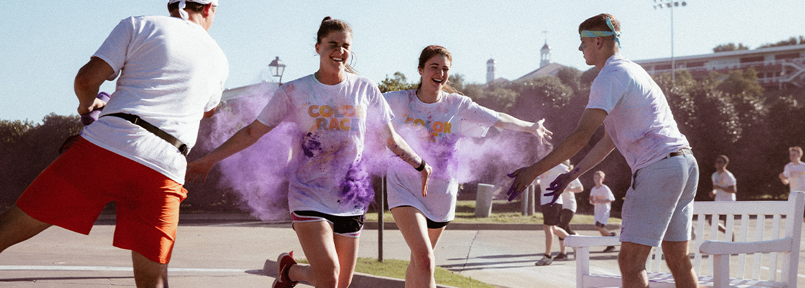 Students running during Color Race