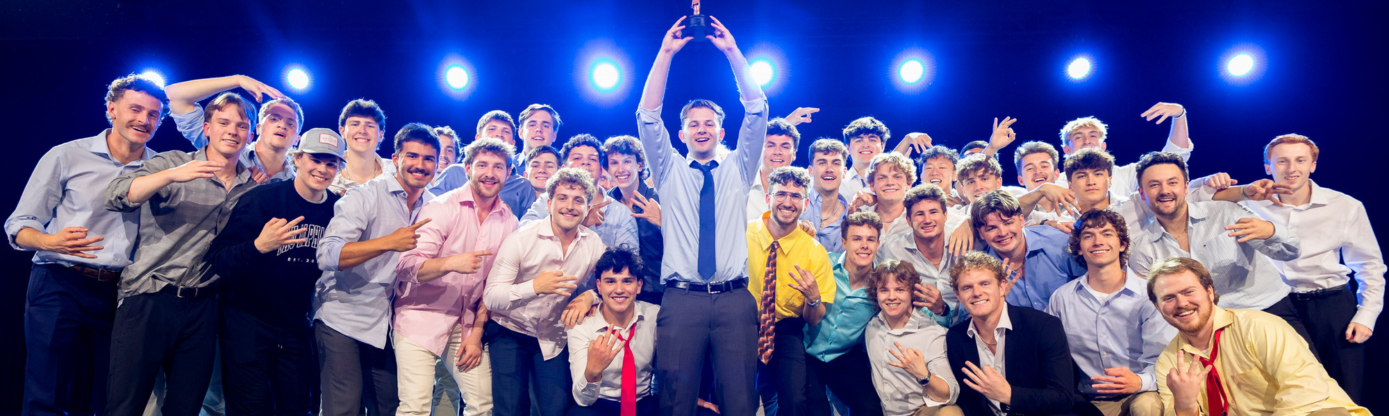 Tau Alpha Phi with trophy 