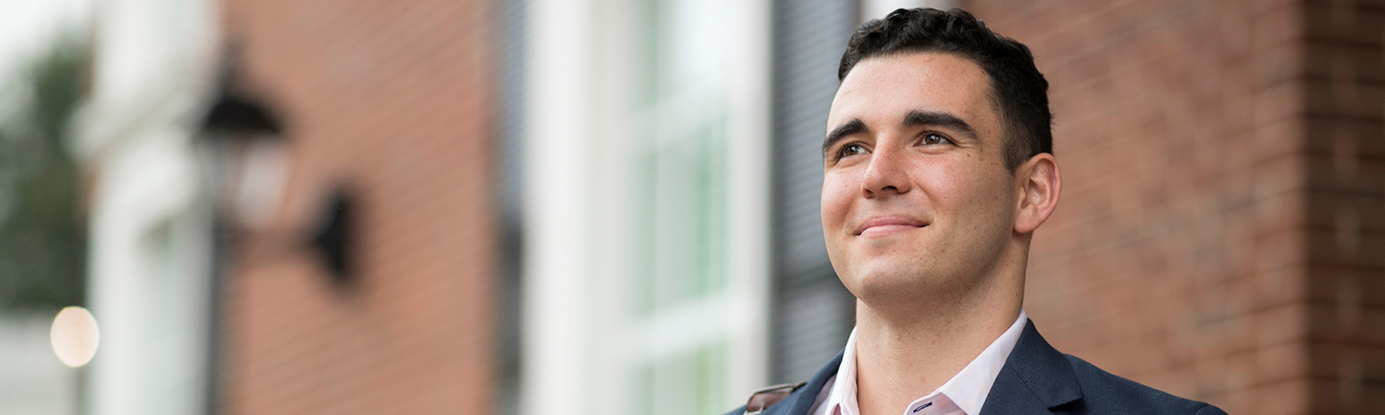 a college student standing outside in Dallas at DBU