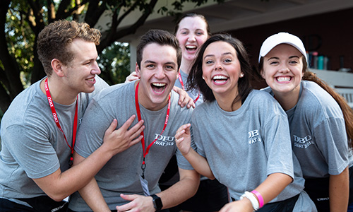 group of 5 students - some being silly and others ready for a picture