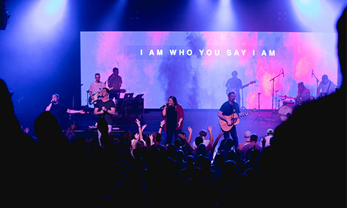 students worshiping to the song who you say I am
