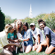 Group of girls petting a dog