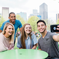 Students taking a selfie downtown