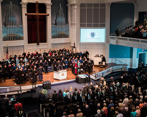 inside chapel - commencement ceremony - overlooking the crowd as graduates walk across the stage