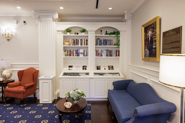 center for baptist history and heritage room bookshelves with a portrait on the right and a couch