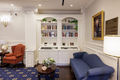 a book shelf, display and seating area in the Center for Baptist History