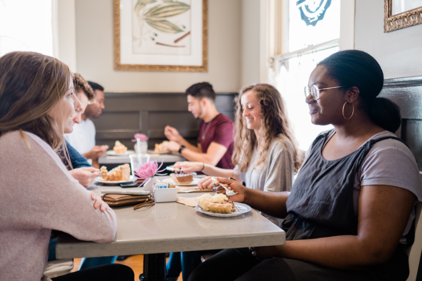 Female students talk over a bite to eat