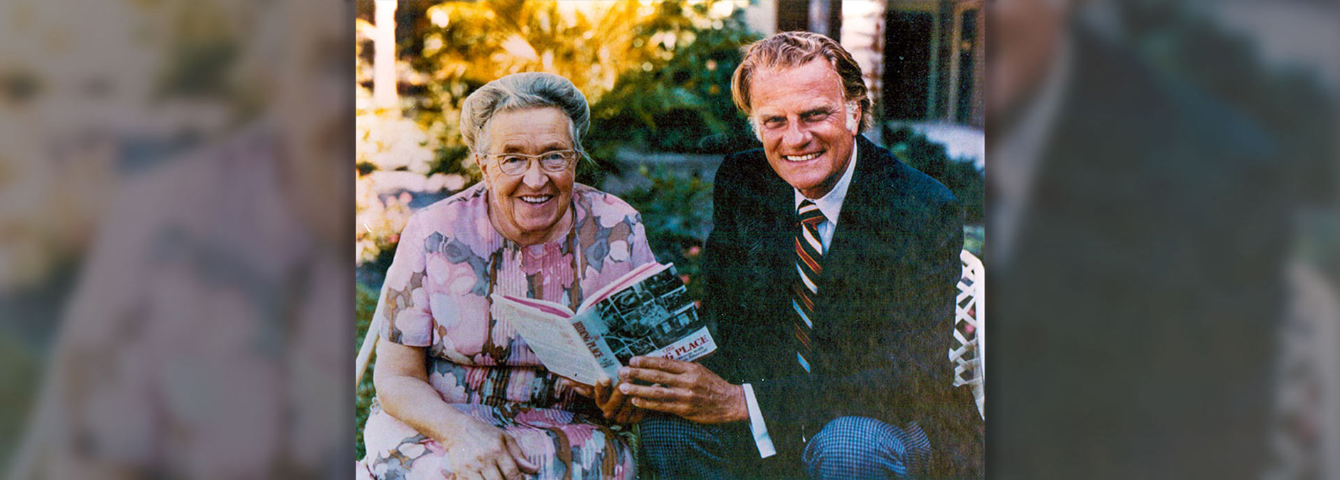 Corrie ten Boom and Billy Graham outside