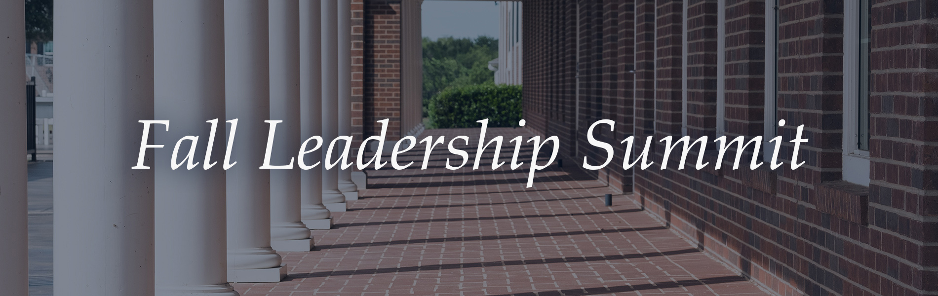 The words Fall Leadership Summit written in white text over a photo of a brick walkway on campus.