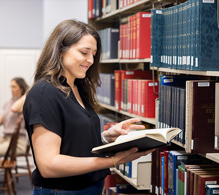 DBU degree completion student in library