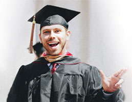 picture of a Dallas college graduate in cap and gown