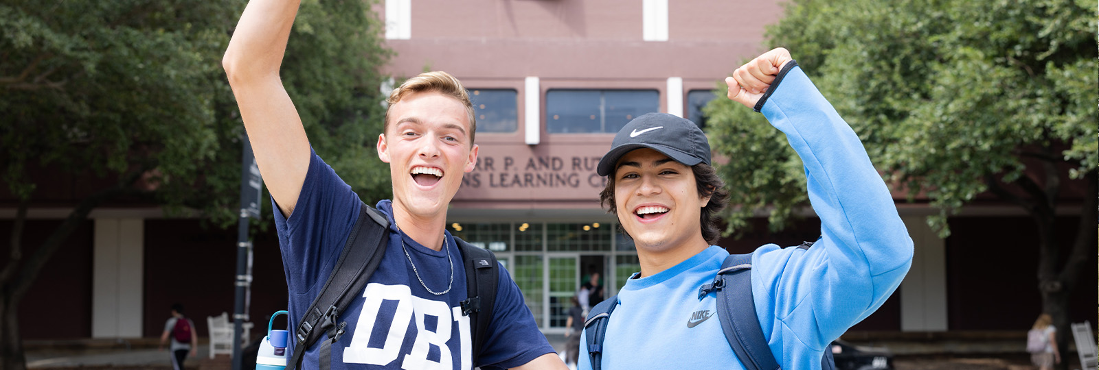 two students in front of the LC