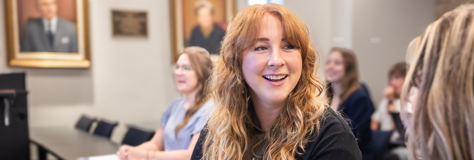 Graduate student talking in class