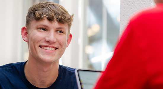student smiling in classroom