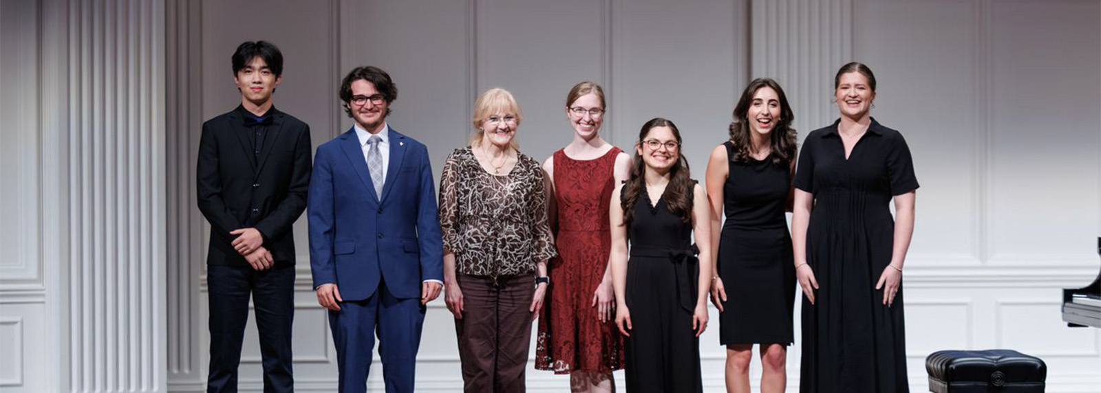 small group of students standing on stage