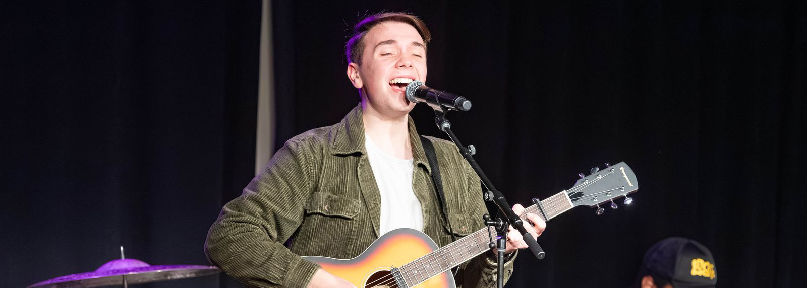 DBU male student with guitar singing