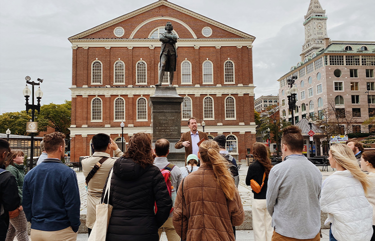 Professor lectures in a square in Boston