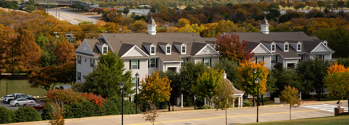 dallas on campus apartments - outside by bush pond