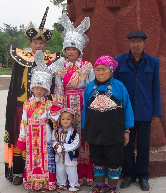 group of people of various ages in Yunnan Ethic Village, China