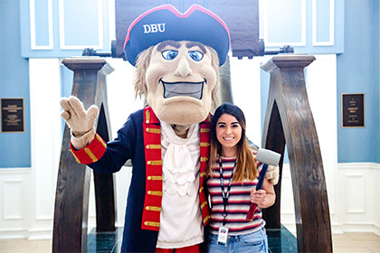 Undergraduate student with Mr. Patriot