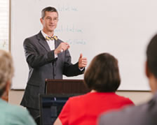  professor lecturing in front of podium