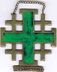 picture of a brass cross with green in the middle