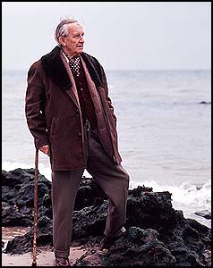 Tolkien standing outside by a body of water