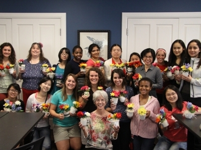 DBU International students display their floral arrangements before taking them to the nursing home.