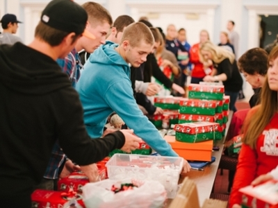 Students packing Operation Christmas Child boxes