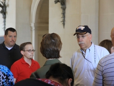 DBU Doctoral Students visit with Captain Doug Rau, a DBU Ph.D. graduate, at the U. S. Naval Academy